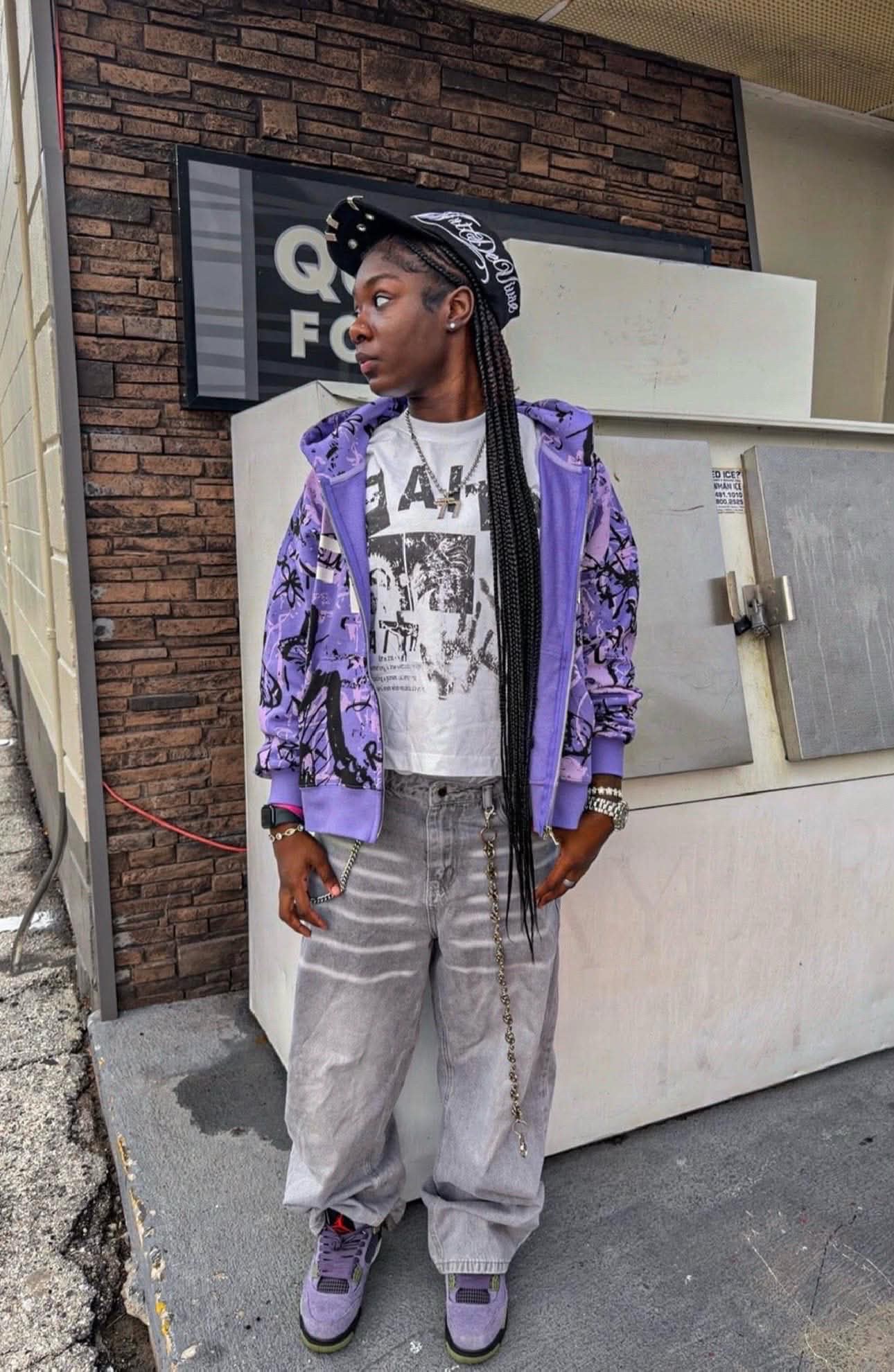 Model in the purple scribble zip hoodie